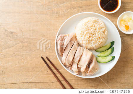 Hainanese chicken rice or rice steamed with chicken soup Hainanese chicken rice or rice steamed with chicken soup 107547136