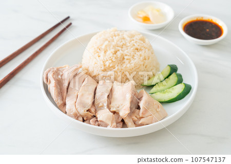 Hainanese chicken rice or rice steamed with chicken soup Hainanese chicken rice or rice steamed with chicken soup 107547137