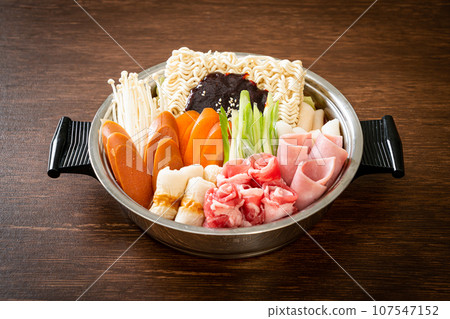 Budae Jjigae or Budaejjigae (Army stew or Army base stew). It is loaded with Kimchi, spam, sausages, ramen noodles and much more Budae Jjigae or Budaejjigae (Army stew or Army base stew). It is loaded with Kimchi, spam, sausages, ramen noodles and much more 107547152