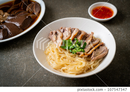 dried duck noodles in white bowl dried duck noodles in white bowl 107547347