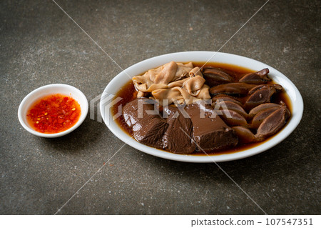 stewed duck offal in brown soup stewed duck offal in brown soup 107547351