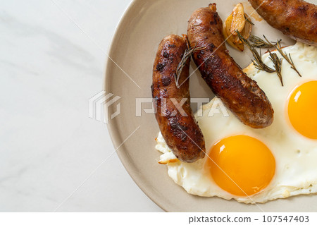 double fried egg with pork sausage 107547403