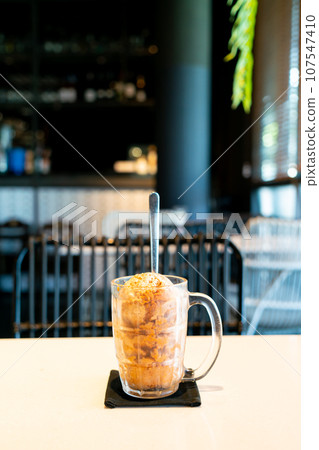 Thai tea ice scoop in glass Thai tea ice scoop in glass 107547410