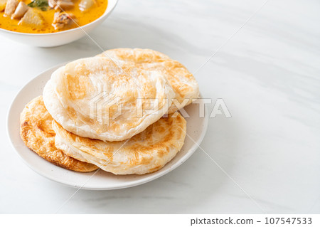 Chicken curry soup with roti Chicken curry soup with roti 107547533