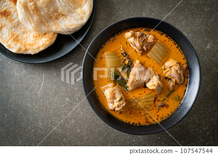 Chicken curry soup with roti Chicken curry soup with roti 107547544