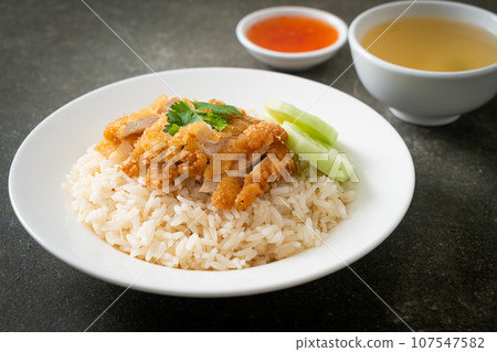 Steamed Rice with Fried Chicken or Hainanese Chicken Rice Steamed Rice with Fried Chicken or Hainanese Chicken Rice 107547582