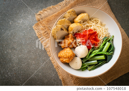 egg noodles with fish balls and shrimp balls in pink sauce, Yen Ta Four or Yen Ta Fo 107548018