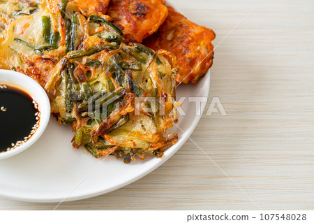 Pajeon or Korean pancake and Korean Kimchi pancake or Kimchijeon on white background 107548028