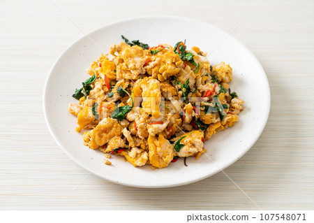 stir-fried egg with Thai basil and chilli stir-fried egg with Thai basil and chilli 107548071