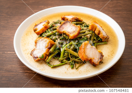 Stir-fried water mimosa with crispy pork belly Stir-fried water mimosa with crispy pork belly 107548481