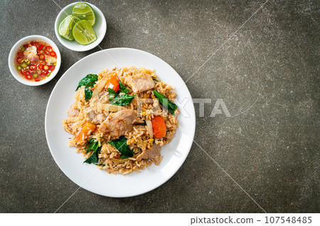 Fried rice with pork on plate 107548485