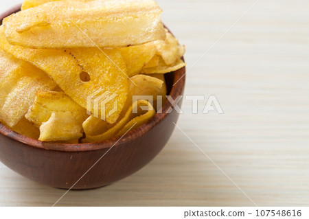 Banana Chips - fried or baked sliced banana Banana Chips - fried or baked sliced banana 107548616