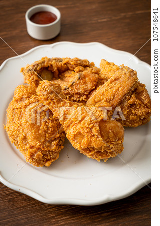 fried chicken with ketchup on plate 107548641