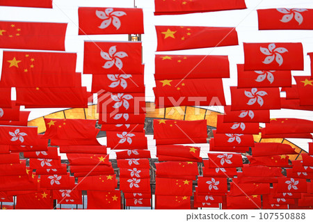 Chinese and hong kong flag set up in the event for celebrating the National Day of the People's Republic of China 74 th anniversary in tsim sha tsui, Hong Kong Chinese and hong kong flag set up in the event for celebrating the National Day of the People's Republic of China 74 th anniversary in tsim sha tsui, Hong Kong 107550888