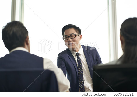 young asian job seeker shaking hands with human resources manager before job interview young asian job seeker shaking hands with human resources manager before job interview 107552181