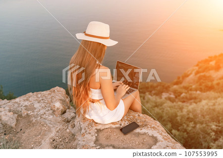 Freelance women sea working on the computer. Good looking middle 107553995