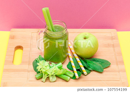 Fresh Green Smoothie of Apple, Celery, and Spinach in Glass Smoothie Jar Fresh Green Smoothie of Apple, Celery, and Spinach in Glass Smoothie Jar 107554199