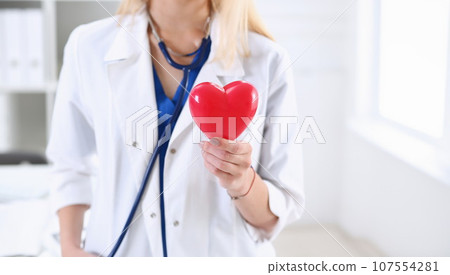 Female medicine doctor hands holding and covering 107554281