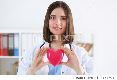 Female medicine doctor hands holding and covering 107554294