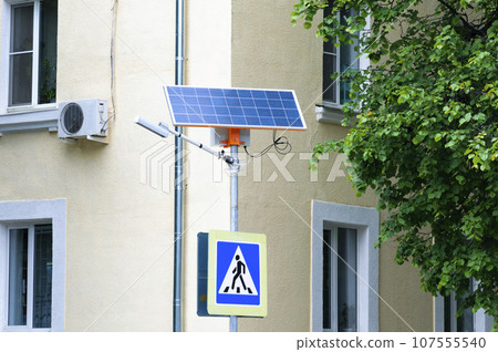Traffic warning pedestrian crossing sign with its own solar panel. 107555540