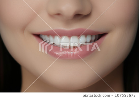AI-generated content. Perfect white teeth smile of a young woman, close up 107555672