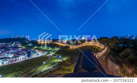 Hwaseong Fortress, with Suwon city view at night, the place of Unesco World Heritage in Seoul South Korea. 107556322