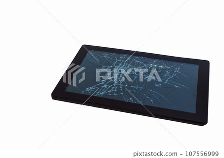 A broken tablet computer as detailed close-up shot on neutral white background 107556999