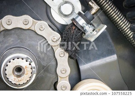 Metal chain and gear in agricultural or industrial machine. Technology Metal chain and gear in agricultural or industrial machine. Technology 107558225