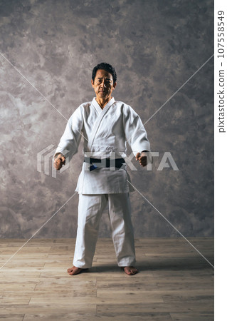 Middle-aged male martial artist wearing a gi 107558549
