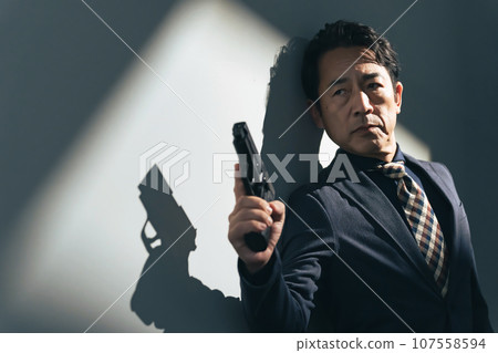 middle-aged man with a gun middle-aged man with a gun 107558594