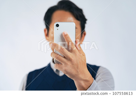 Men looking at smartphones 107558613