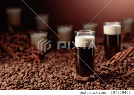 White Russian cocktail. Vodka, coffee liqueur, and cream. 107559462