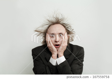 Funny shocked nervous businessman on white background, studio portrait 107559758