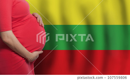 Pregnant woman belly on Lithuanian flag background Pregnant woman belly on Lithuanian flag background 107559806