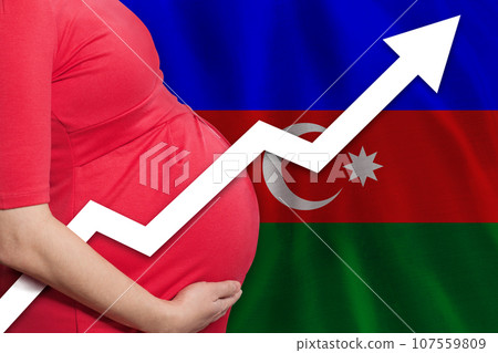 Pregnant woman in Azerbaijan on Azerbaijani flag background. Birth rate up 107559809