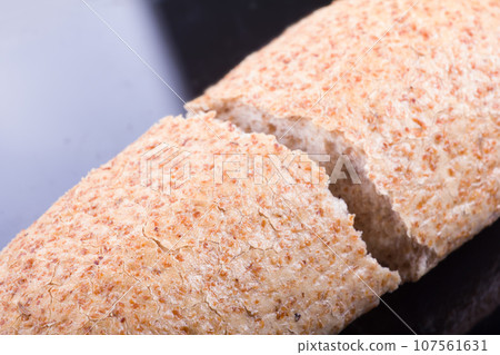 Breaking Bread on a dark glass background Breaking Bread on a dark glass background 107561631