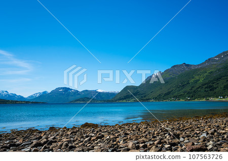 Summer, Beach, Lofoten, Norway. Stunning view point of mountains and blue sea Lofoten islands Summer, Beach, Lofoten, Norway. Stunning view point of mountains and blue sea Lofoten islands 107563726
