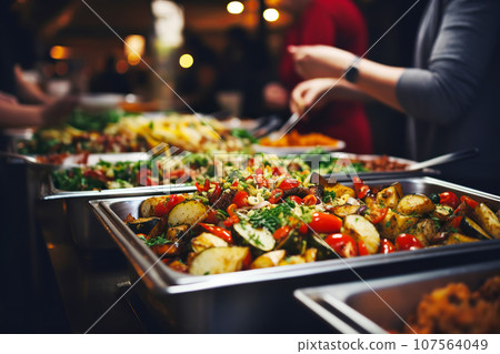 Catering buffet food. Delicious colorful meat and vegetable dishes. Celebration Party Catering buffet food. Delicious colorful meat and vegetable dishes. Celebration Party 107564049