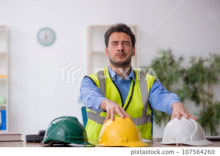 Young male architect working in the office 107564260