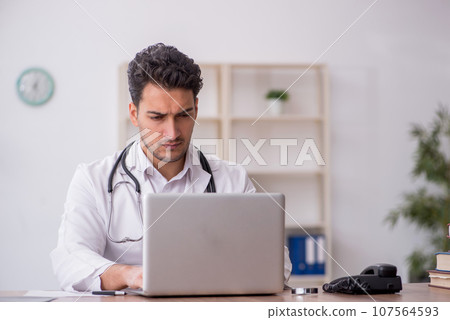 Young male doctor in telemedicine concept Young male doctor in telemedicine concept 107564593