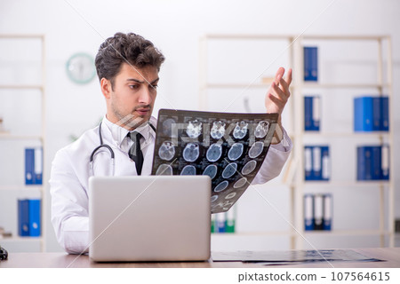 Young male doctor radiologist working in the clinic 107564615