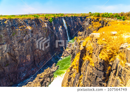 Victoria Falls on Zambezi River in dry season. Border between Zimbabwe and Zambia, Africa Victoria Falls on Zambezi River in dry season. Border between Zimbabwe and Zambia, Africa 107564749