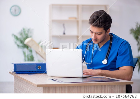 Young male doctor in telemedicine concept Young male doctor in telemedicine concept 107564768