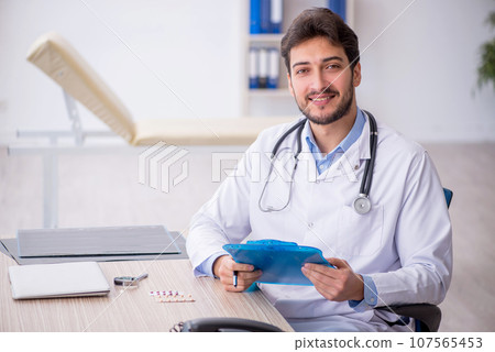 Young male doctor working in the clinic 107565453