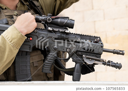 Israeli assault rifle or machine gun in soldier's hands Israeli assault rifle or machine gun in soldier's hands 107565833