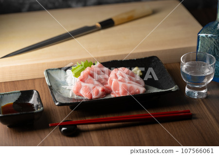 blue fin fatty tuna with japanese sushi knife blue fin fatty tuna with japanese sushi knife 107566061