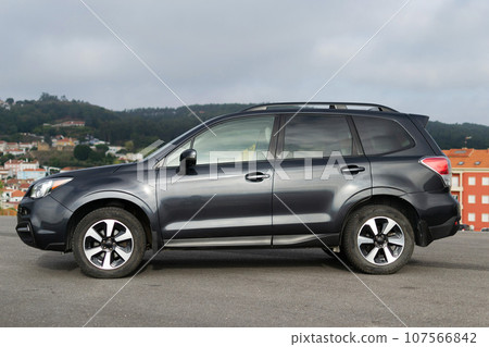 Grey SUV auto, power luxury model. Shiny polished stationary vehicle. Grey SUV auto, power luxury model. Shiny polished stationary vehicle. 107566842