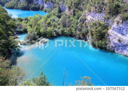Plitvice Lakes National Park, a world natural heritage site in Croatia, the vivid blue of the lake seen from the Lower Lakes hill 107567312