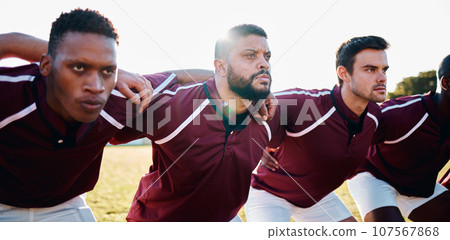 Man, huddle and team in scrum for sports collaboration coordination or focus in the outdoors. Group of sport men in fitness training, planning or getting ready for serious game, match or start 107567868