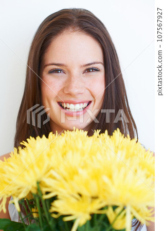 Happy, flowers and smile with portrait of woman for spring, beauty and celebration gift. Present, summer and blossom with face of girl and bouquet isolated on white background for plant and season 107567927